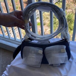 NWT - Coach Denim shoulder bag with (2) front pockets & silver hardware.